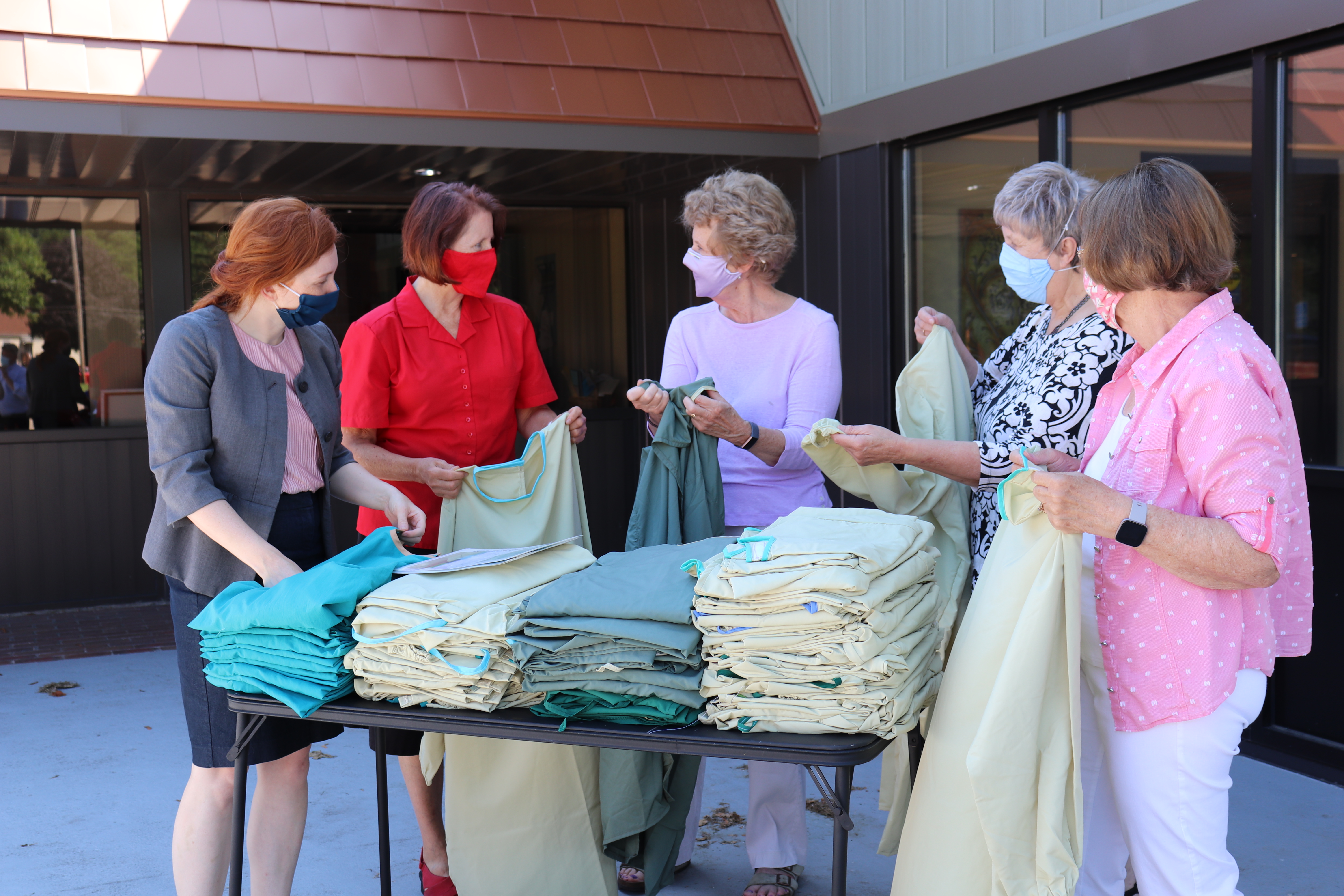 Volunteers donate gowns to the Ramsey County Care Center