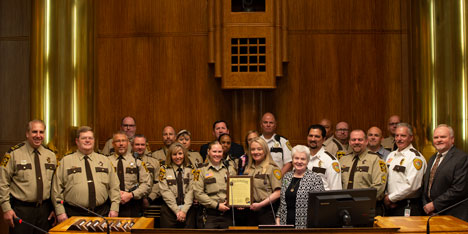 Correctional officers receiving proclamation from Commissioner Reinhardt