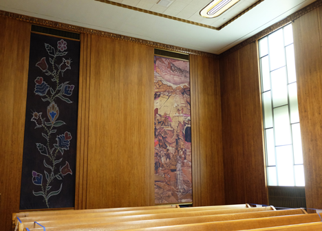 East side view of the murals in council chambers