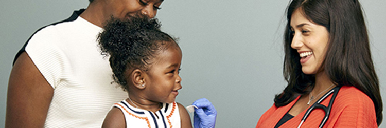 Three children display bandaids on their arms next to the words "Is your child up to date on vaccinations?"