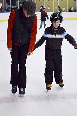 Mom and son ice skating