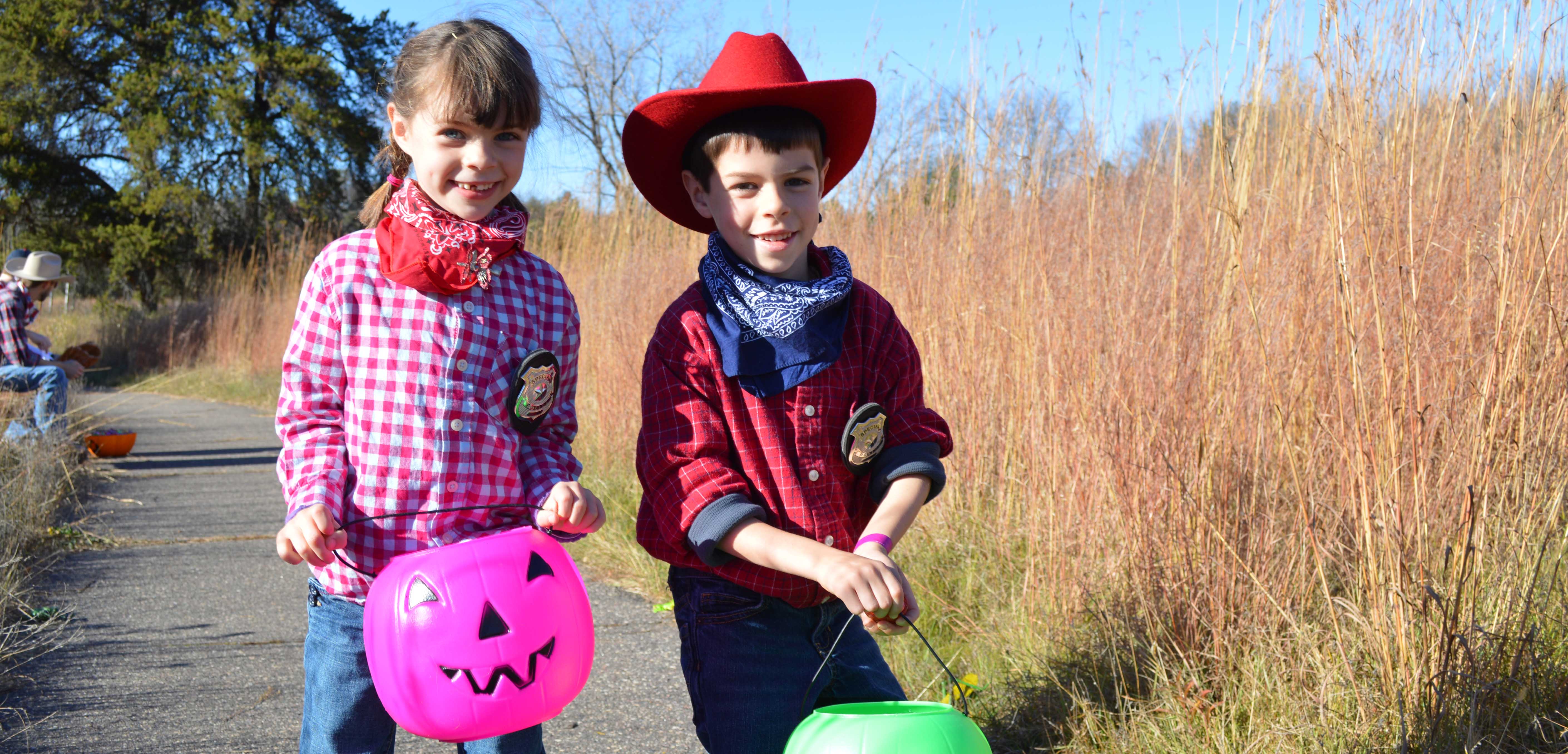 Young children in costumes at the Tamarack Trick or Treat event