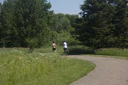 Two people walking on the Birch Lake Regional trail