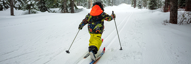 child skiing on snow