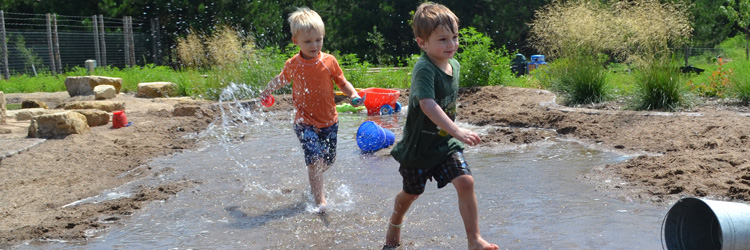 Boys playing in The Stream