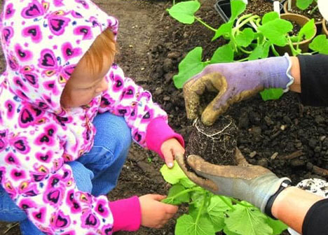 Young girl in the Tamarack garden