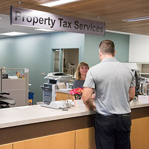 Resident and staff at the Property Tax Services counter