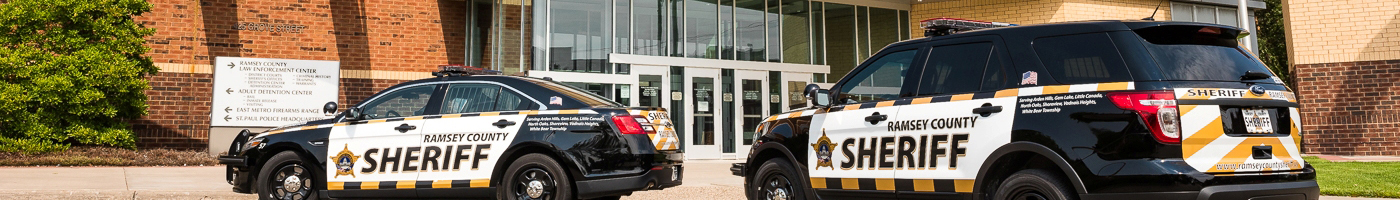 Exterior of Law Enforcement Center with squad cars