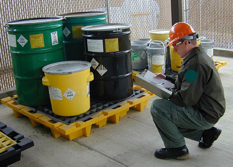 Person inspecting hazardous waste storage area