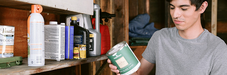 Man collecting Household Hazardous Waste site in garage
