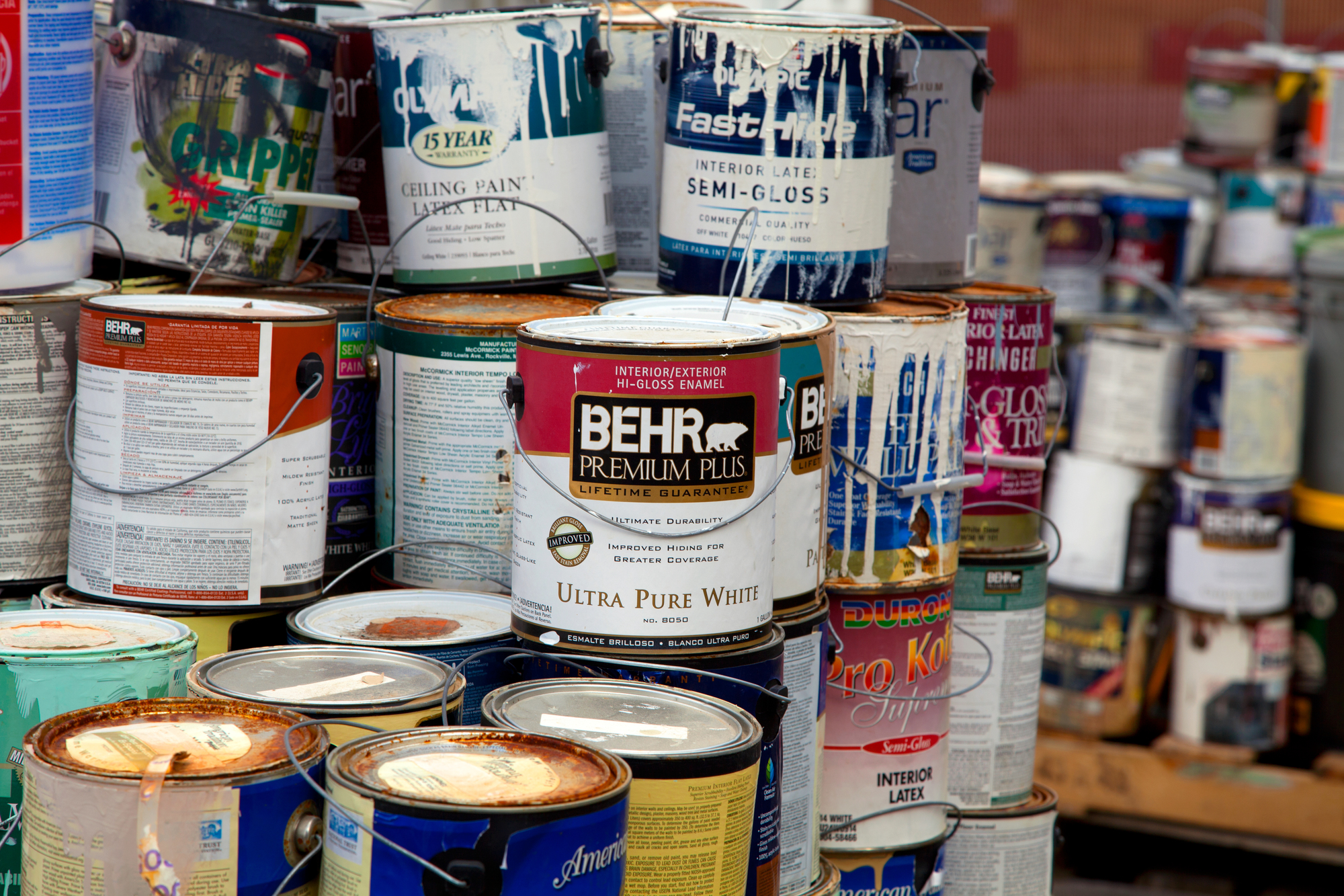 Piles of used paint cans