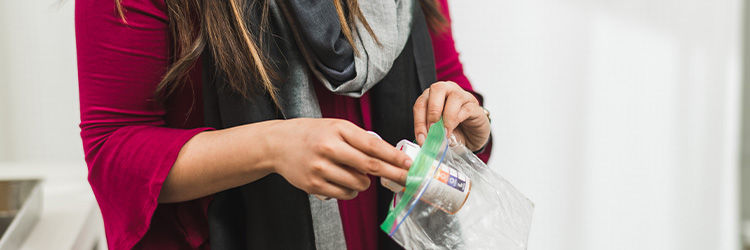 Person holding bag of medicine