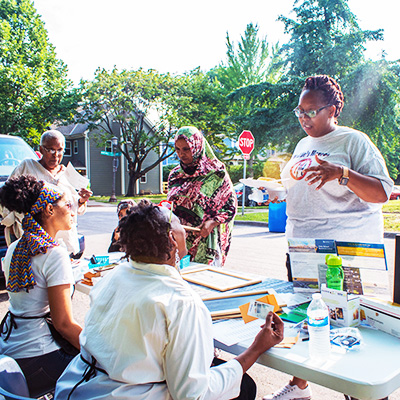 Local artists talking with community members