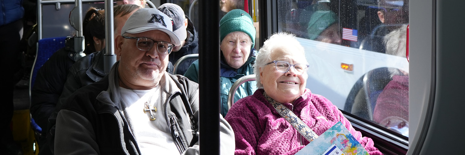 Many people riding a bus.