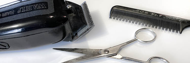 Photo of barber hair trimmer, scissors and comb