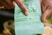 A compostable bag with the BPI logo on it.