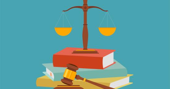Photo of legal scale on top of books and gavel