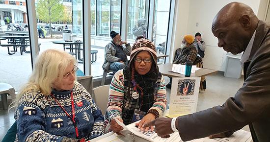 Elections outreach resources at a table. 