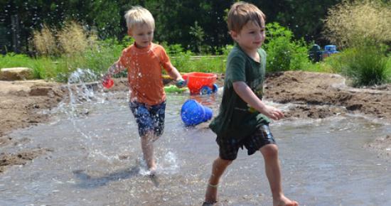 Boys running through The Stream of Discovery Hollow Boys running through The Stream of Discovery Hollow