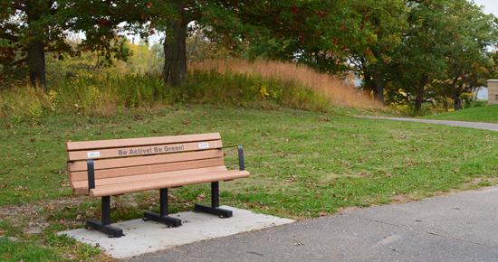 Park bench along side a walking path
