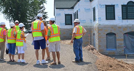 Construction crew in front of a building