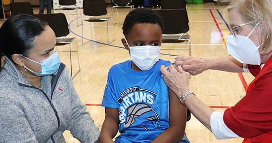 Mother and son getting their COVID-19 vaccine.