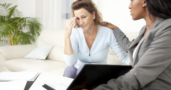 Photo of a victim or witness being comforted by a woman