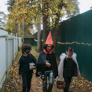 Kids wearing Halloween costumes